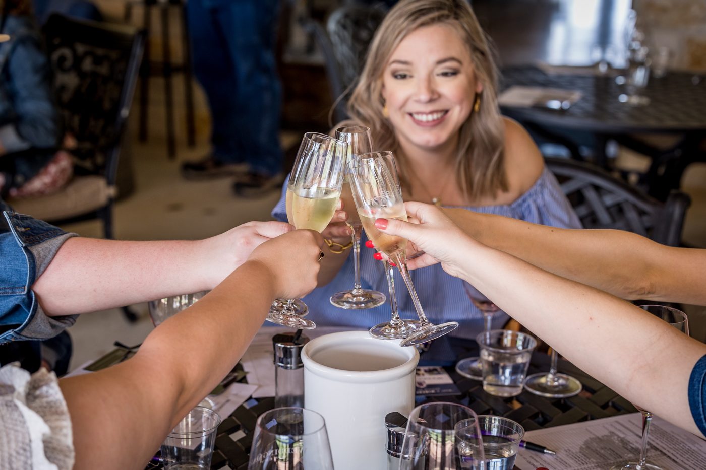 The whole group toasting with sparkling wine